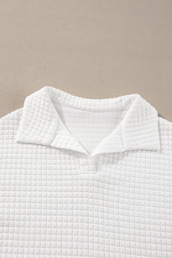 White long sleeve top with sporty collar and quilted texture