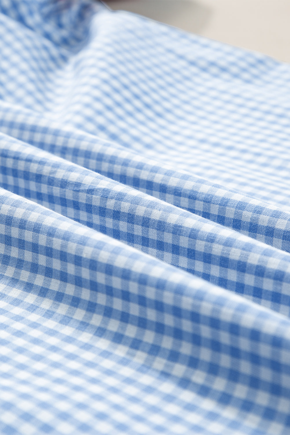 Hellblau Gingham Blumenbluse bestickte Puffhülle