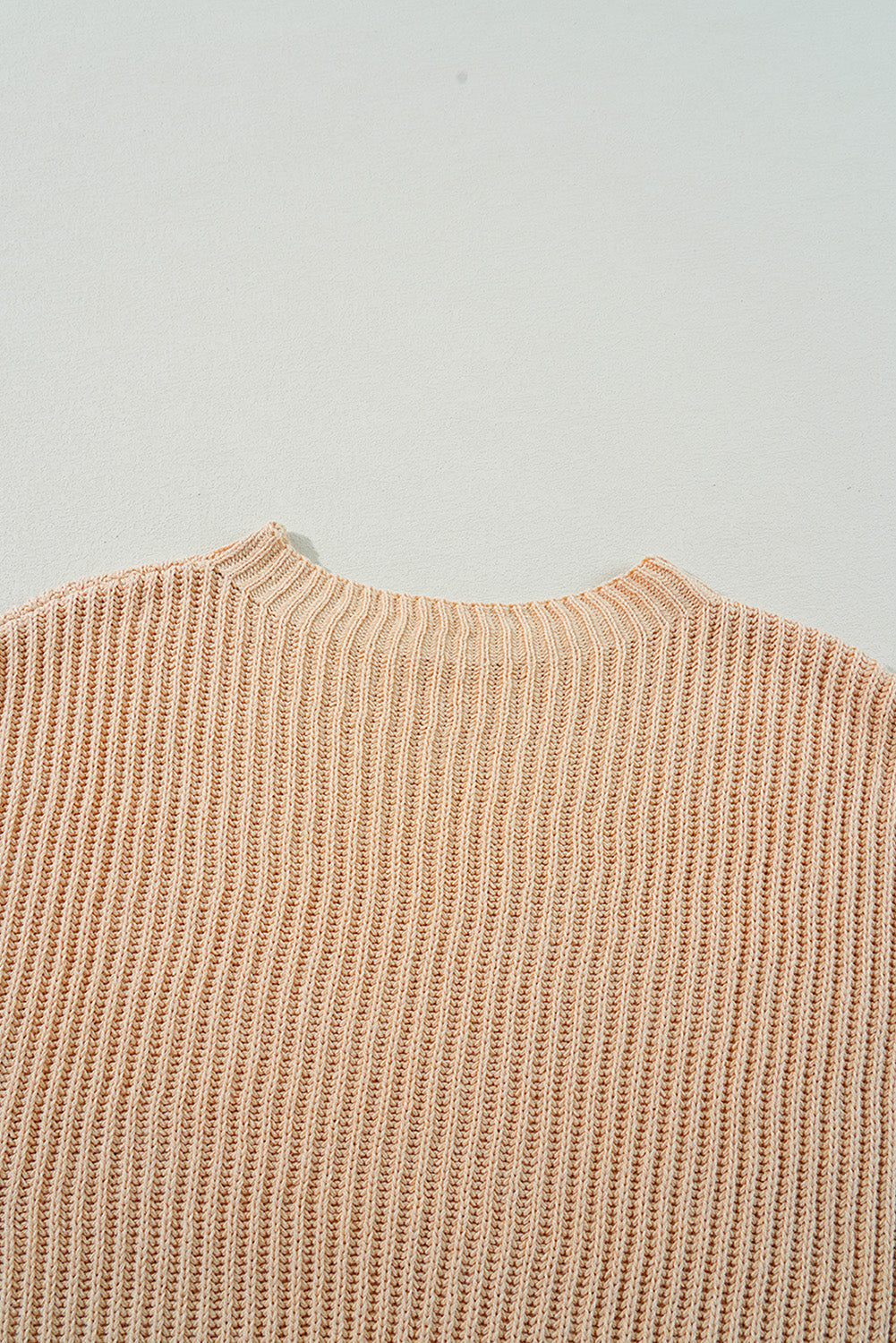 Pull ample en tricot torsadé abricot avec épaules tombantes et fentes latérales