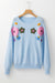 Light blue knitted sweater with ribbed edges with flowers pattern