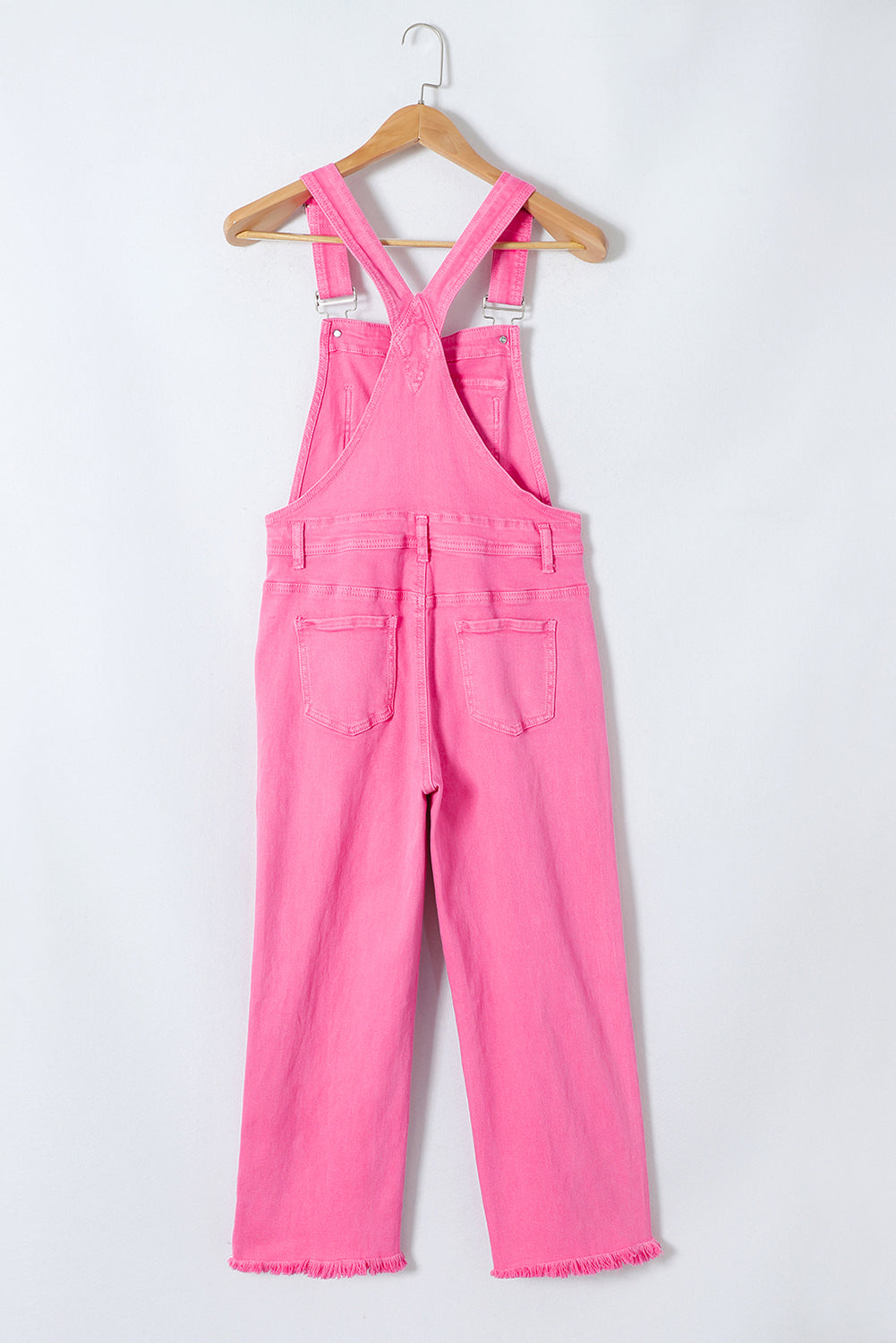 Pirouette - Distressed denim overalls with large pockets and wide legs