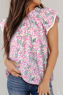 Top rosa con mangas flotantes y collar vertical con estampado abstracto multicolor