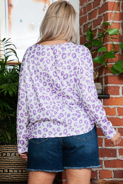 High purple printed leopard with boat collar and shoulders drooping in large embossed spray