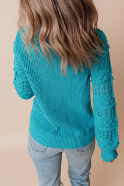 Turquoise bubble sleeve sweater with ruffled eyelets