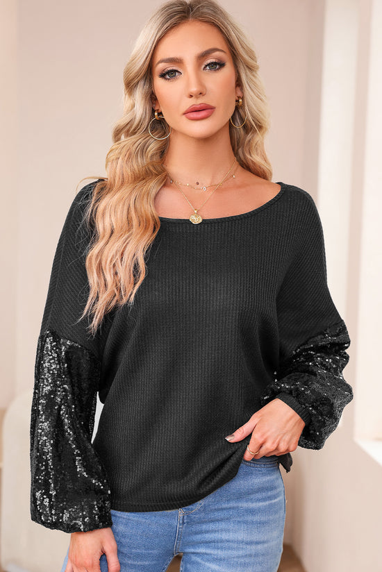 Black waffle knit top with patchwork sleeves and open back