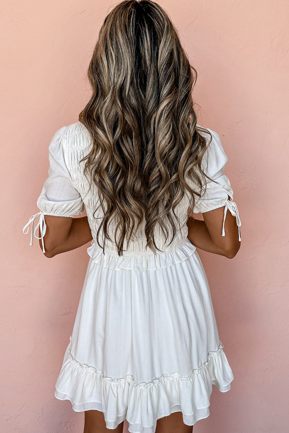 White ruffled and smocked mini dress, short sleeves, tie