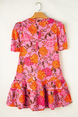 Mini-robe fleurie rose à manches bouffantes *
