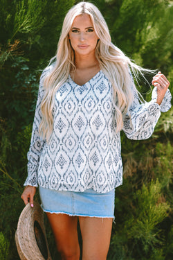 Sky blue blouse with gathered geometric print with puffy sleeves and V -neck