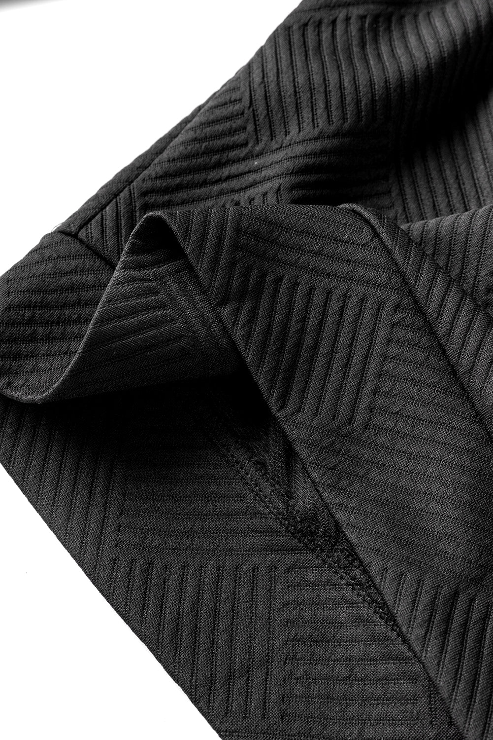 Boutons asymétriques noirs détaillé le sweat texturé haut de cou