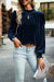 Navy blue velvet blouse with rising collar and puffy sleeves