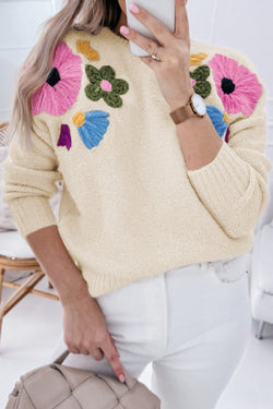 Beige knitted sweater with ribbed edges with flower pattern