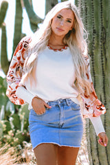 White sweater with bishop sleeves and floral patch