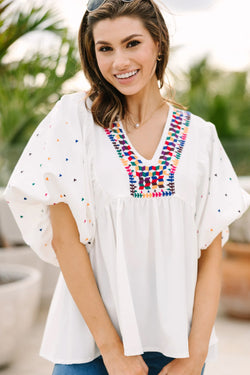 White blouse embroidered with puffy sleeves and v -collar