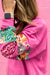 High pink sweater with mixed prints and drooping shoulder patches *