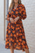 Orange floral print wrap dress with belt