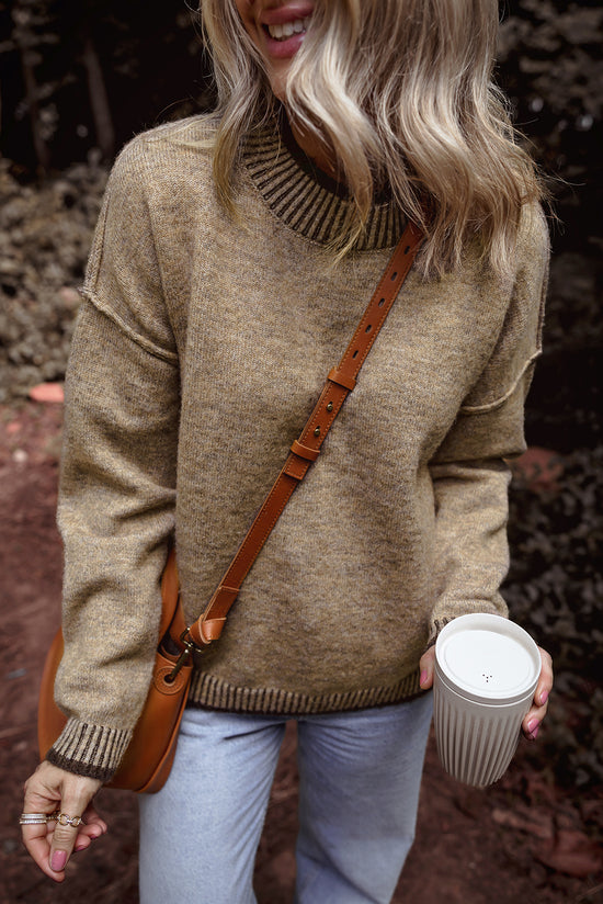 Pale khaki sweater with dropped shoulders and high neck with contrasting trim