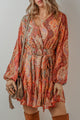 Orange bohemian paisley print mini dress with long sleeves and pleated belt