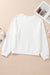 White long sleeve drop shoulder top with bow tie pattern