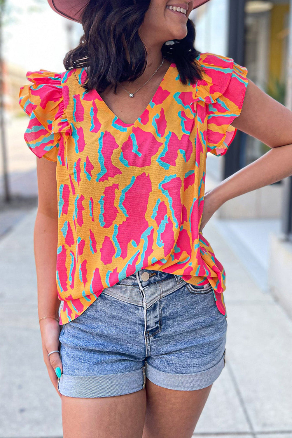 Orange blouse with abstract print *