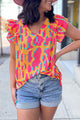 Orange blouse with abstract print *