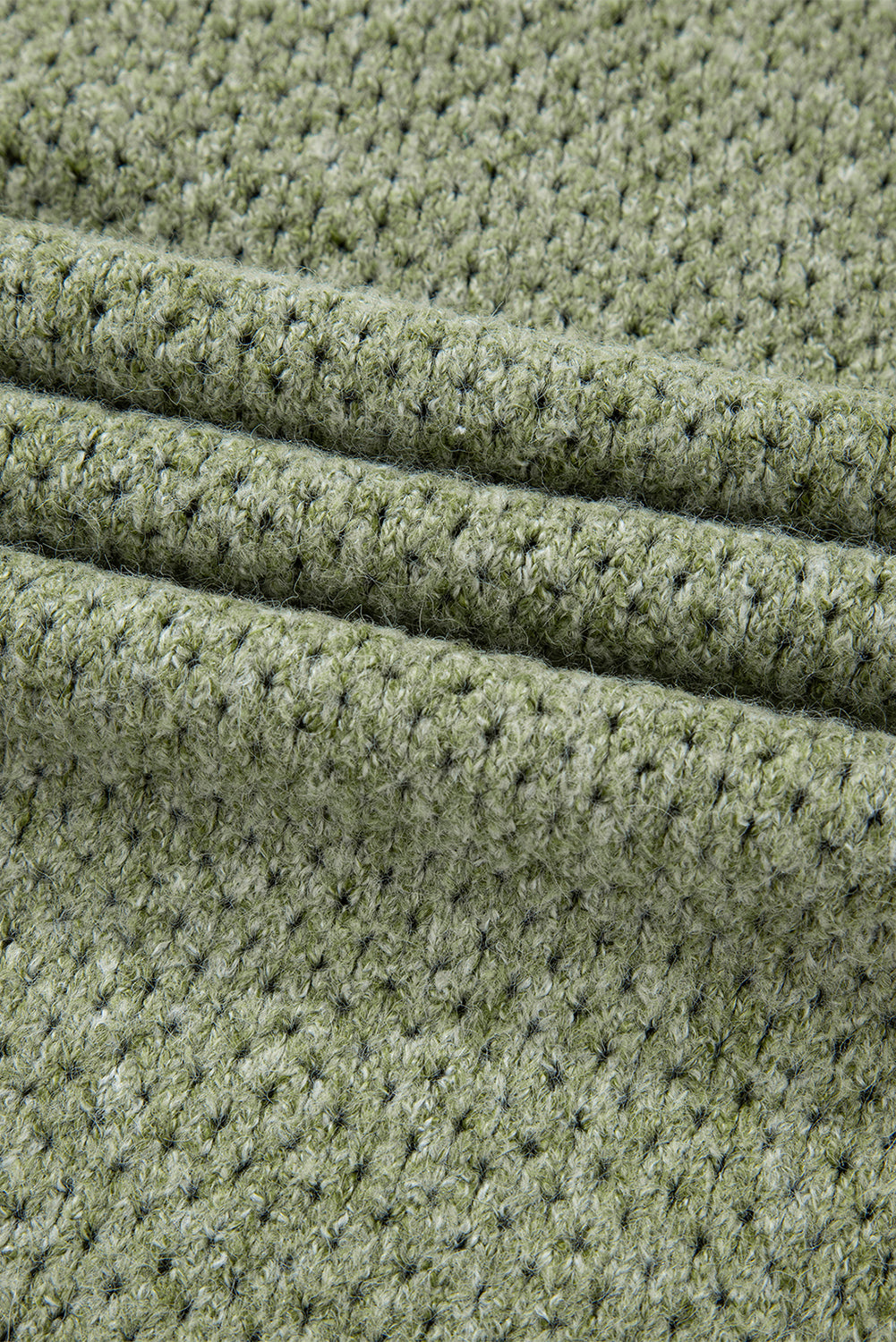 Pull ample à œillets vert jungle, col en V, épaules tombantes