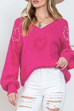 V -neck sweater and stuffed hearts decorated with pink red pearls