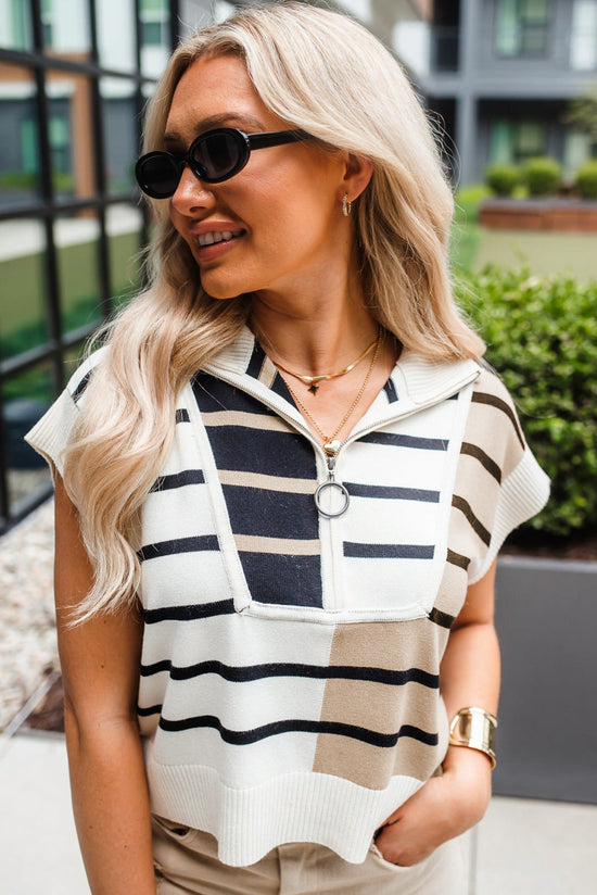 Black sweater vest with color block stripes and zipped collar