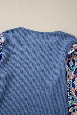 Ashleigh - Blue blouse with ruffles and floral sleeves in woven knitting with round neck