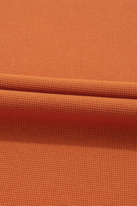 Haut orange en tricot texturé avec bloc de couleurs *