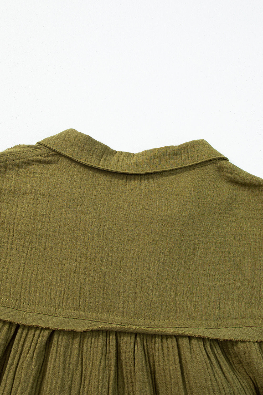 Green flared dress with frayed edging, split collar, puffed sleeves