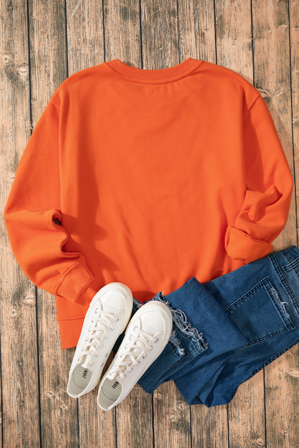 Sudadera en tela de esponja con hombros caídos y forro en united anaranjado de color rojo naranja