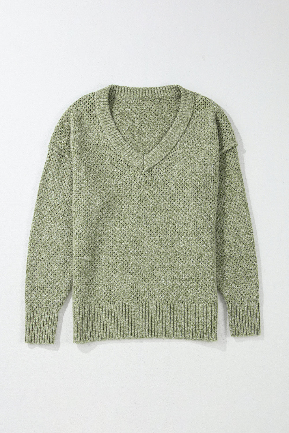 Pull ample à œillets vert jungle, col en V, épaules tombantes