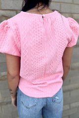 Camiseta rosa texturizada con mangas hinchadas