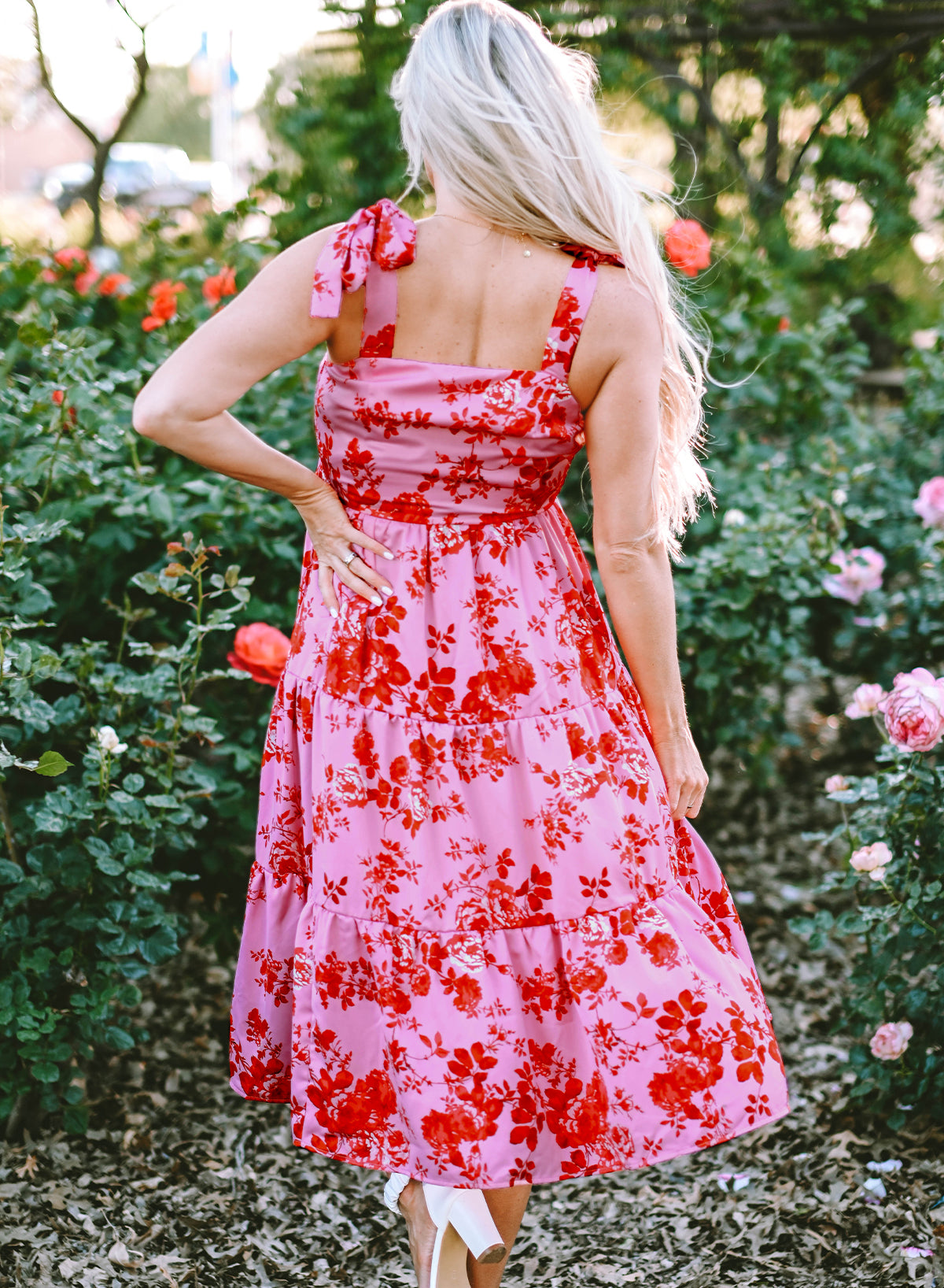 Pink floral dress with ruffles and tied straps