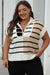 Black sweater vest with color block stripes and zipped collar