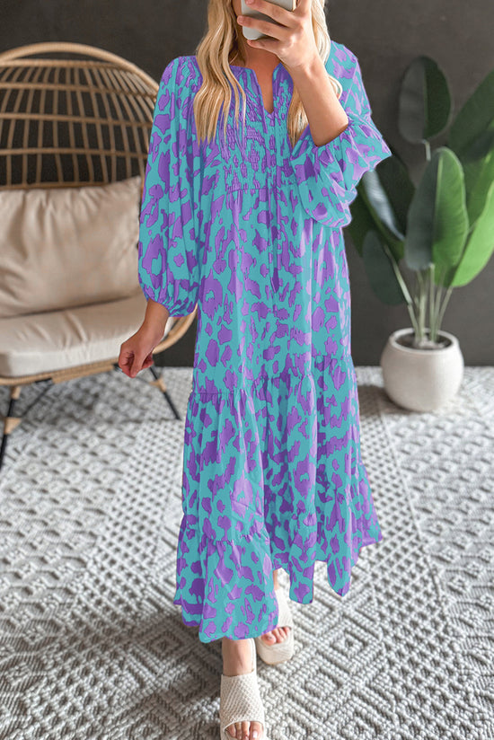 Sky blue long dress with abstract print, puffed sleeves, knotted and notched collar