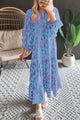 Sky blue long dress with abstract print, puffed sleeves, knotted and notched collar