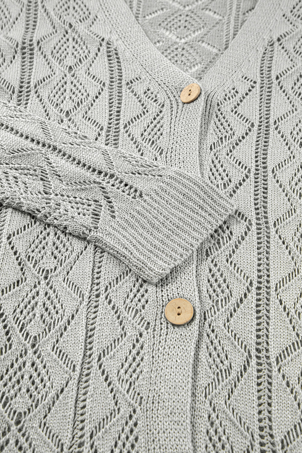 Long gray cardigan with openwork buttons on the front