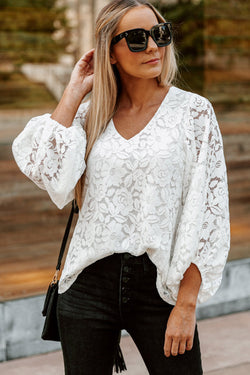 Ample white high with V -neck and crochet floral lace