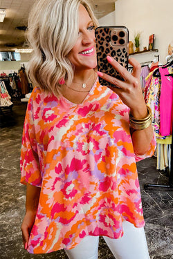 Summer blouse in v -collar in v abstract pink red print