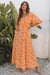 Robe longue smockée à imprimé floral orange*