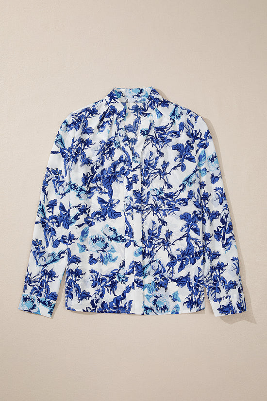 Elegante blusa con cuello con muescas y estampado floral azul floral