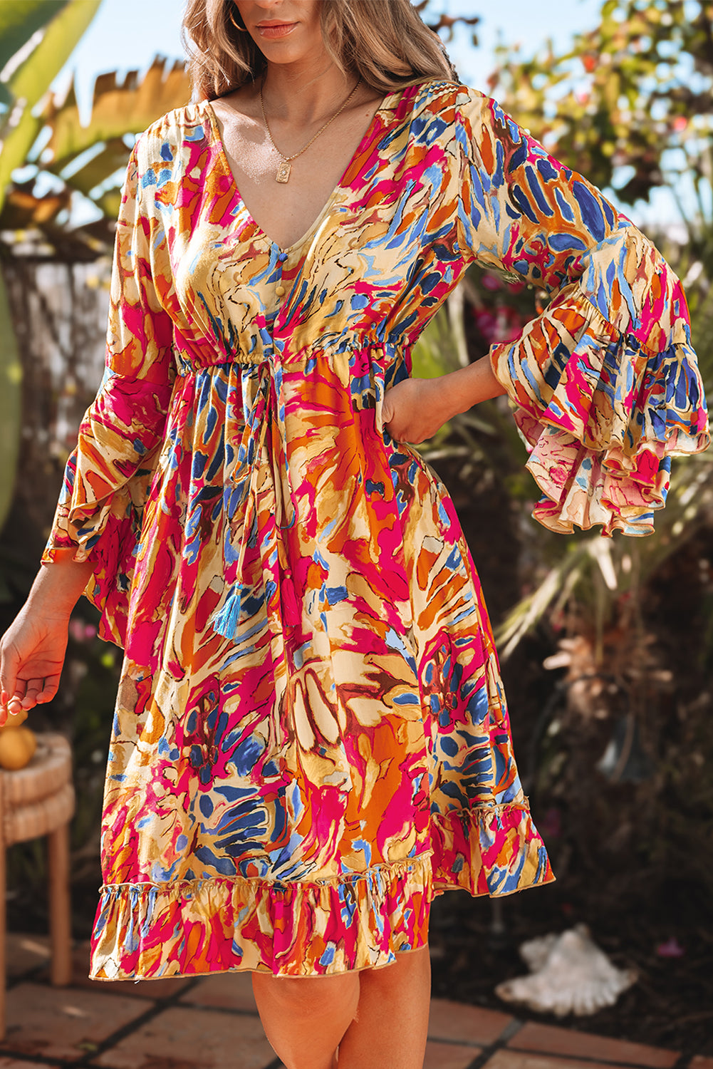 Robe fluide rose à manches évasées *