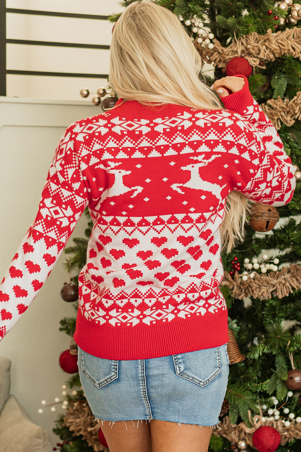 Bright red mock neck sweater with merry christmas reindeer heart pattern