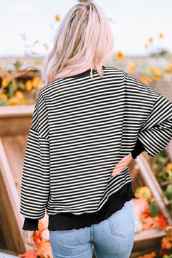 Long sleeve top and drooping shoulders with black stripes