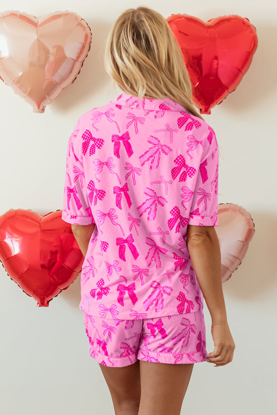 Pink pajama set with half-long sleeve shirt and node print shorts