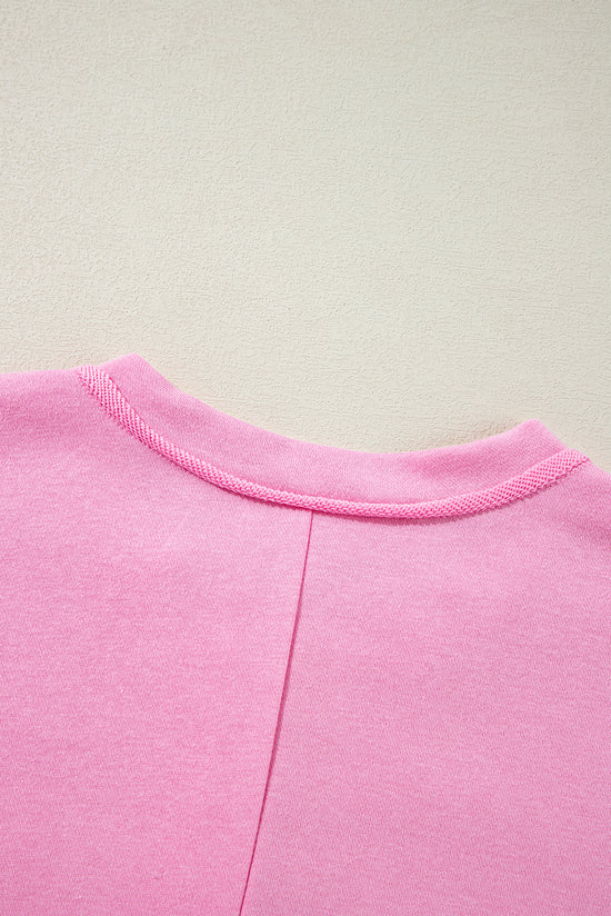 Amplia sudadera con boutheter rosa unido