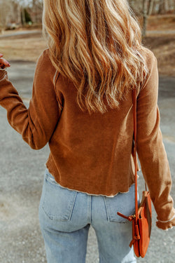 High textured brown with long sleeves and round neck *