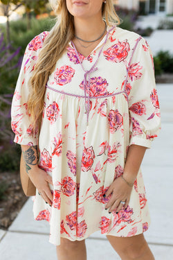 Mini dress with floral print with lace -ups and V -neck with large white balloon sleeves