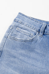 High blue flared jeans faded with acid with raw hem